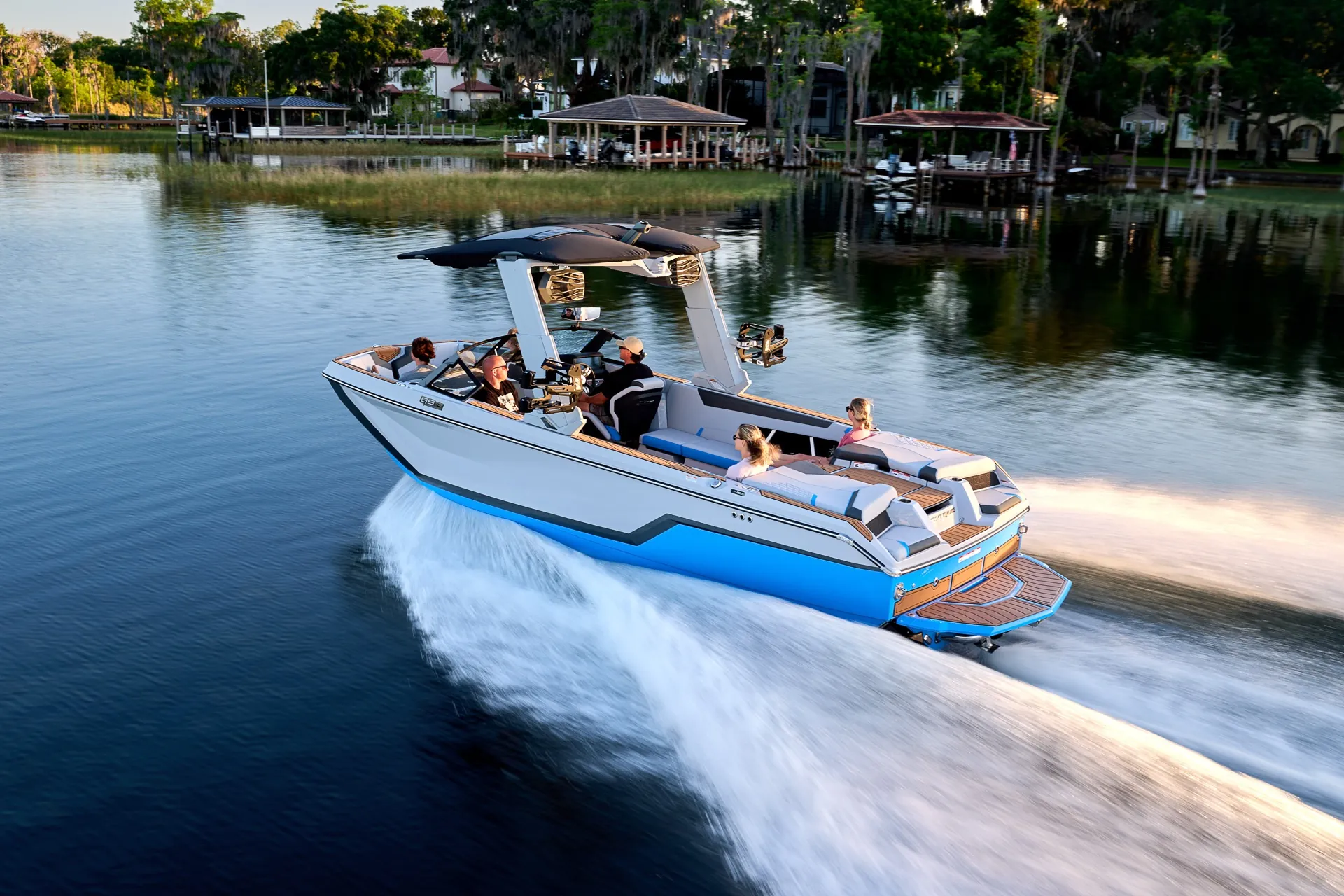 A Super Air Nautique GS24 cruising with family aboard